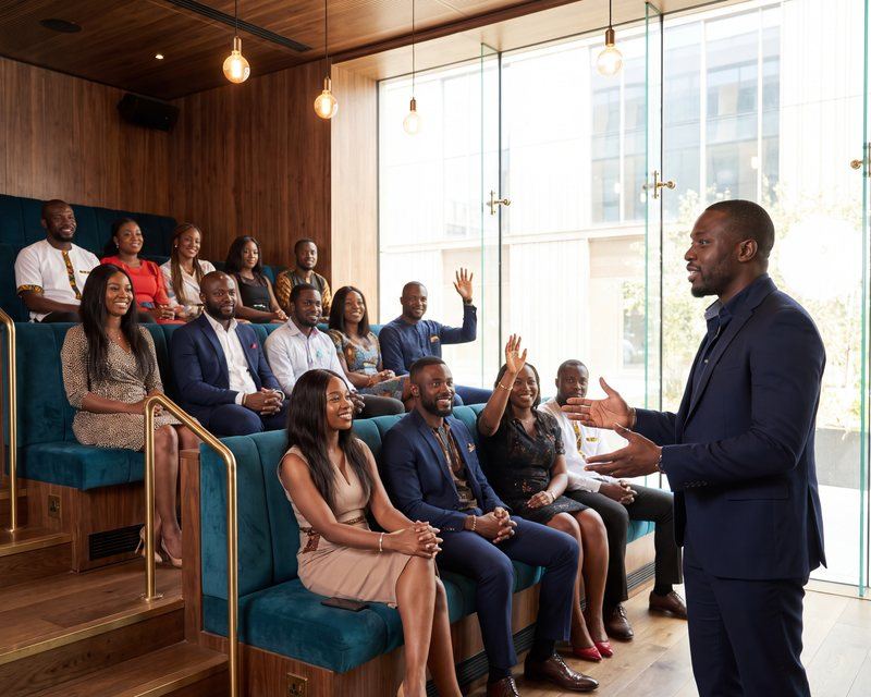 An informed mobility briefing, a facilitator answering questions from a seated audience