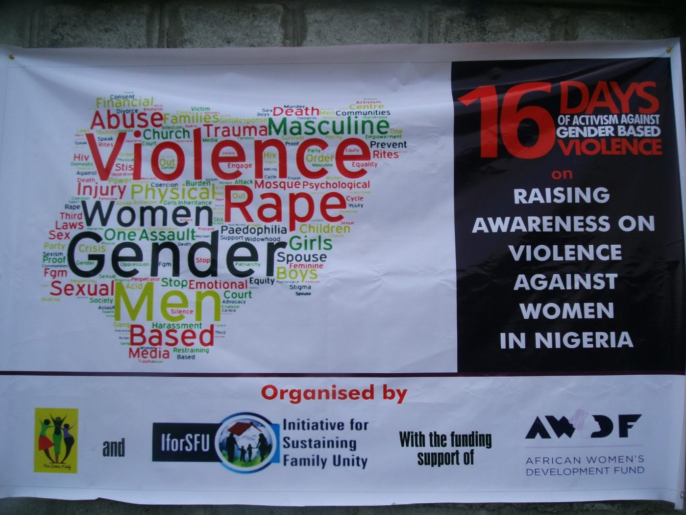 The 16 Days of Activism banner — a visible landmark at the awareness stand, Tejuosho, November 2015.
