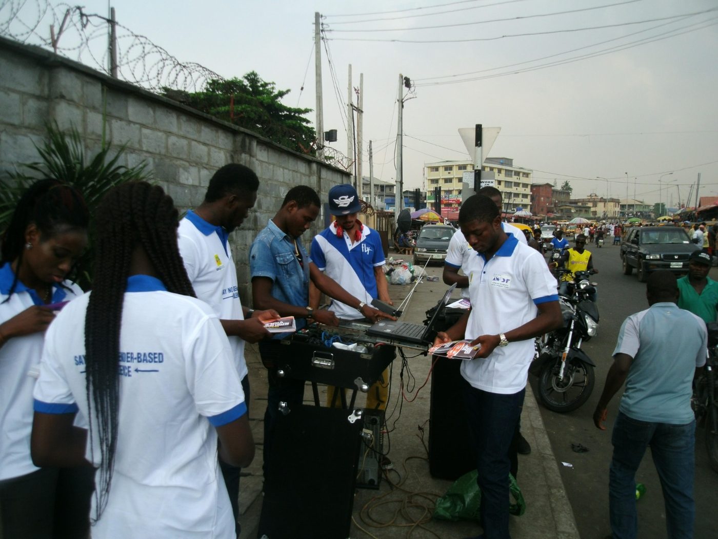 Volunteers distributing information materials in the streets around Tejuosho Market, November 2015.
